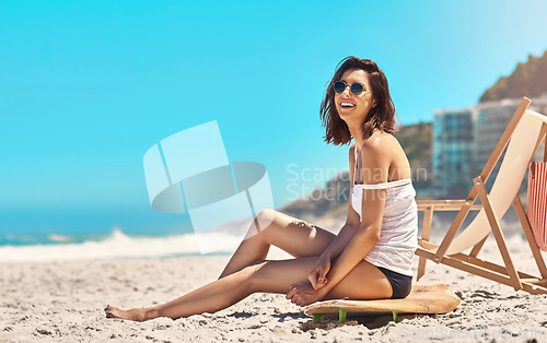Image of Woman, sand and sitting on surfboard with smile, beach or sunglasses in summer nature for vacation mockup space. Young surfer girl, relax outdoor and happy with excited face for holiday by ocean
