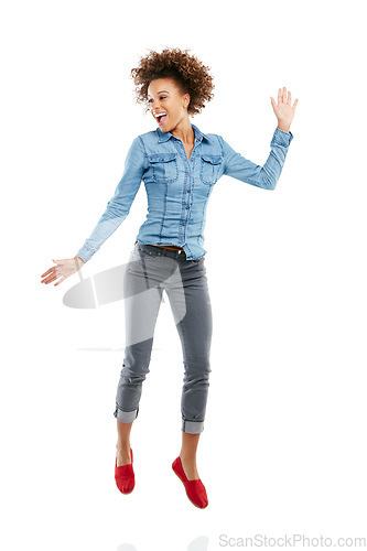 Image of Dance, happy young black woman jumping and in white background. Energy or positivity, person expressing freedom and isolated African female model jump for joy or excitement in studio backdrop