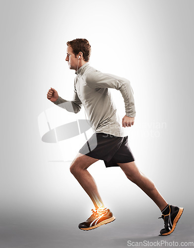 Image of Man running, exercise and ankle pain with overlay, fitness injury and medical emergency on studio background. X ray, anatomy and skeleton with male runner with injured foot, inflammation and sprain