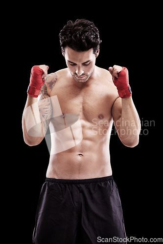 Image of Man, shirtless and fists in boxer bandage or focus, thinking and ready for boxing fight in isolated studio black background. Athlete, martial arts and healthy fitness, strong fighter and sports