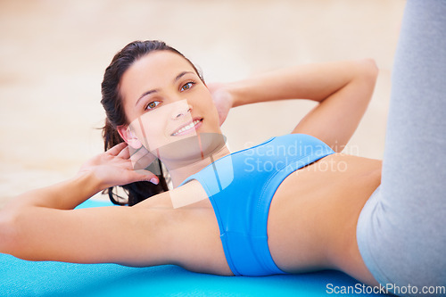 Image of Happy woman, portrait and relax in yoga for exercise, ab workout or training on mat at gym. Female yogi relaxing on floor smiling or exercising core muscles, stretching or healthy wellness in sit ups