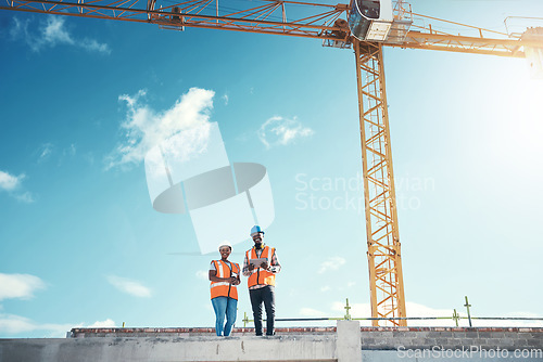 Image of Engineering, tablet and team on building roof at construction site for vision, development or architecture. Black woman and man outdoor for engineer project or safety inspection with sky mockup