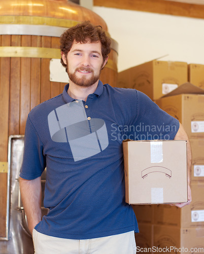 Image of Portrait, beer and box with a man in a brewery for the production, packaging and delivery of alcohol. Warehouse, logistics and industry with a male brewer in a factory for stock taking or shipping