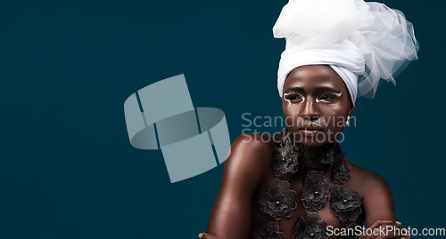 Image of Art, fashion and a thinking black woman for culture isolated on a dark background in a studio. Mockup, idea and an African person wearing traditional headwear with cosmetics for cultural confidence