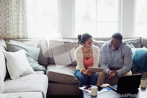 Image of Happy couple, paperwork and on the sofa together or using laptop for bills or invoice and notebook for tax at home. Accounting, young family and on laptop or couch in the house or mortgage documents