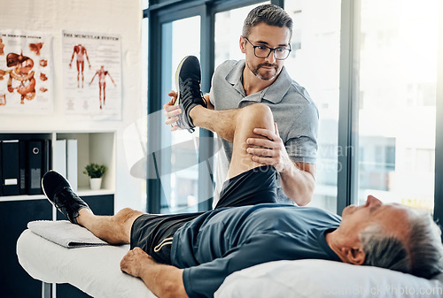 Image of Stretching legs, rehabilitation and a physiotherapist with a man for wellness and disability support. Help, health and a male doctor helping an elderly person with physiotherapy on body muscle