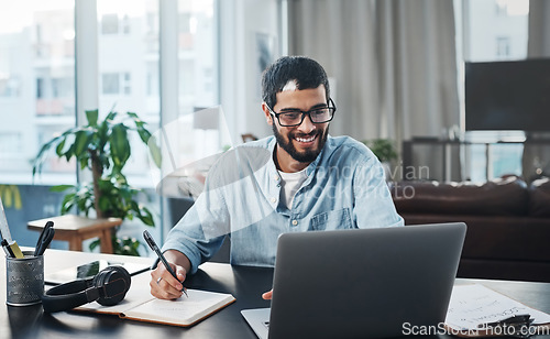 Image of Laptop, writing notes and man with remote work planning a creative freelance project at his home. Technology, reading and male freelancer doing research on computer while working in his living room.