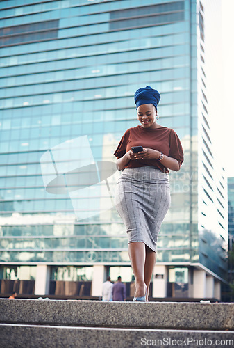 Image of Black woman, phone text and city walking of a employee with happiness and social network app. African female person, mobile communication and networking with tech and internet by urban streets