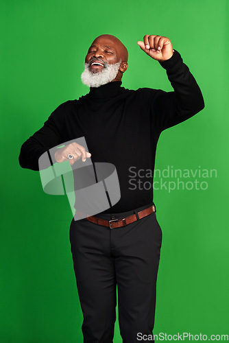 Image of Happy, dance and smile with black man on green screen for celebration, music or excited. Happiness, dancer and energy with senior person dancing isolated on studio background for freedom and movement