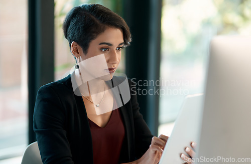 Image of Tablet, computer and business woman in office for website analysis, online management or technology solution. Review, typing or scroll of professional biracial person on desktop and digital software