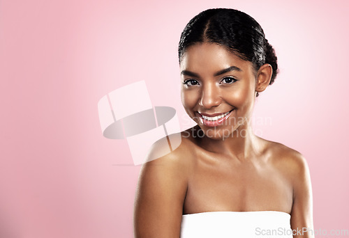 Image of Portrait, happy woman and face for skincare on pink background, studio and mockup for clean dermatology. African, female model and natural beauty with confidence, glowing skin and aesthetic cosmetics