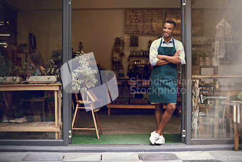 Image of Thinking, coffee shop and man or small business owner at front door with a smile. Entrepreneur person as barista, manager or waiter in restaurant for service, career pride and startup goals