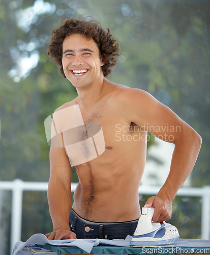 Image of Happy, portrait and a man ironing a shirt, doing chores and housework in the morning at home. Laughing, handsome and a guy with tools to iron clothes, housekeeping and getting ready with a smile