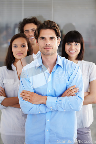 Image of Business people, portrait and arms crossed in leadership, management or teamwork at the office. Confident employee professional standing in confidence for team building or company goals at workplace