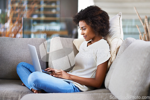 Image of Relax, typing and woman on a couch, laptop and search website at home, happiness and network. Female person, model in a lounge and lady with technology, chilling and online reading on weekend break