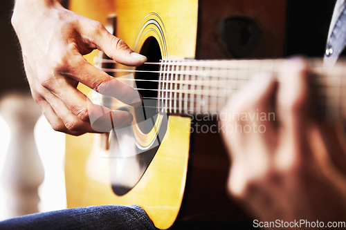 Image of Closeup, hands or man with a guitar, musician and creative with sounds, training and practice for performance. Zoom, male performer or artist with string instrument and professional guitarist playing