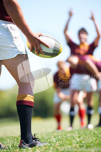 Image of Rugby, closeup and man with a ball in hand outdoor on a pitch for teamwork, target and score. Male athlete team playing in sports competition, game or training match for fitness, workout or exercise