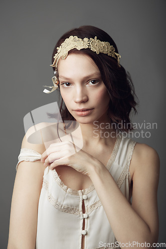Image of Fashion, natural beauty and portrait of woman in studio isolated on a gray background. Beautiful, vintage clothes and serious female model from Australia with retro style, headband and cosmetics.