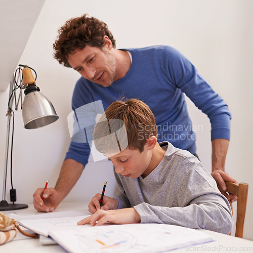 Image of Education, father and son with homework, talking and learning at home, studying and writing. Family, happy dad and male child with books, knowledge and teaching for growth, development and lesson