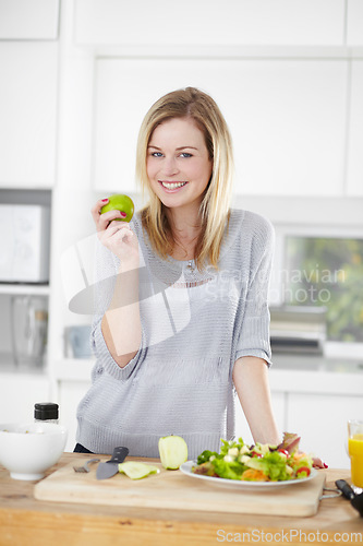 Image of Kitchen, apple and portrait of woman with salad for healthy eating, meal and lunch at home. Food, nutrition and happy female person smile with fruit and vegetables for vegan diet, wellness and detox