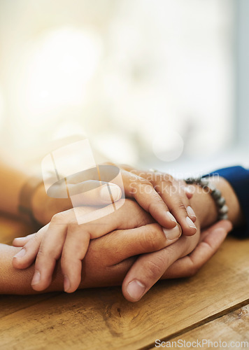 Image of Holding hands, mockup and closeup with trust, solidarity and community on a home table. Therapy, care and gratitude of friends together with hope, respect and love for grief empathy and forgive