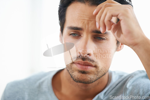 Image of Sad, stress or worried young man on white background in studio with problem. Anxiety face, mental health and stressed out headache for male person thinking or frustrated from depression on backdrop.