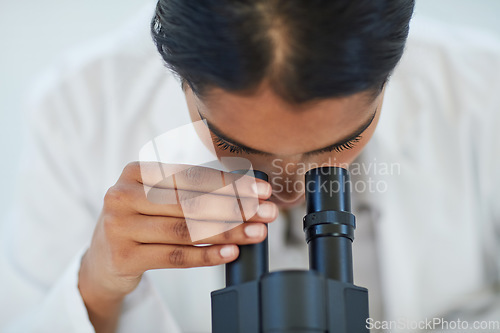 Image of Science, medical research and female scientist with a microscope for analyzing microbiology in a lab. Healthcare, biotechnology and woman researcher working on a project in pharmaceutical laboratory.