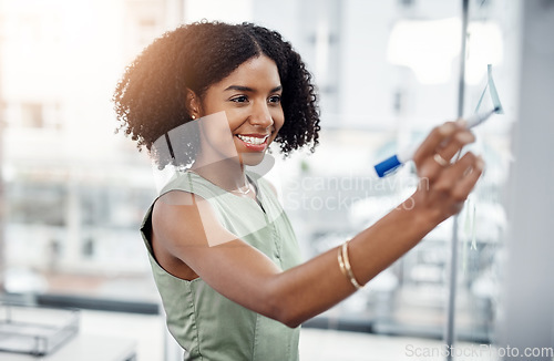 Image of Glass wall, business and black woman writing, planning or strategy in office. Brainstorming, board and happy female person write, working on project and schedule, notes or information in workplace.