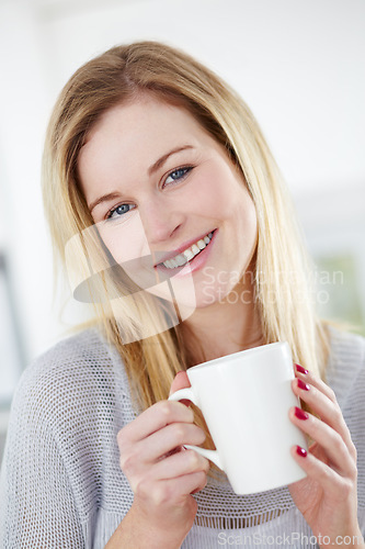 Image of Smile, relax and portrait of woman with coffee in a kitchen, calm and content in her home. Happy, face and female drinking tea in her apartment, peaceful and confident with a comforting morning drink