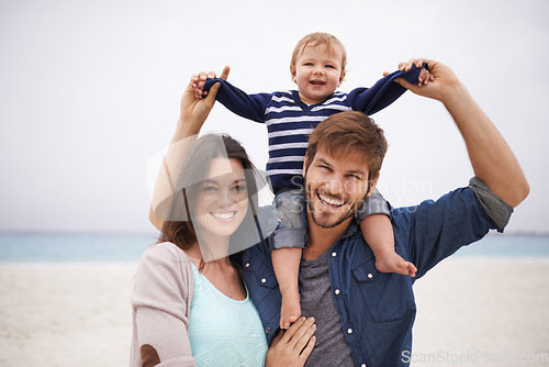 Image of Family and portrait of baby with parents at a beach for piggyback and walking in nature. Face, kid and happy woman with man outdoors bonding, smile and relax with love, freedom and travel