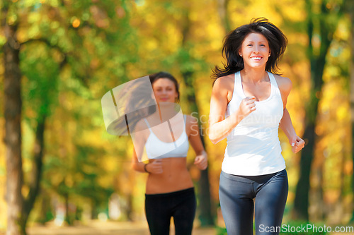 Image of Wellness, nature and women training or running in a forest with mockup feeling happy and excited together. Health, fitness and female people or runner friends in exercise and workout in the woods