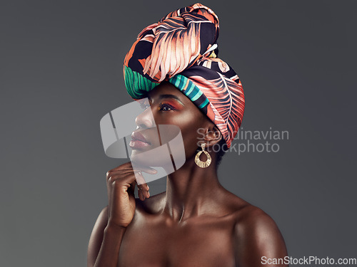 Image of Beauty, makeup and profile of black woman with turban in studio with classy, elegant and traditional accessories. Culture, cosmetic and African female model with head wrap isolated by gray background