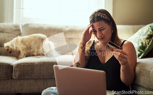 Image of Laptop, credit card and woman headache, debt or confused for home loan, payment anxiety or fintech problem on floor. Stress, choice and decision of young person on computer, banking scam and mistake