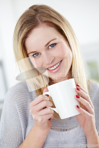 Image of Portrait, smile and woman relax with coffee in a kitchen, calm and content in her home. Happy, face and female drinking tea in her apartment, peaceful and confident with a comforting morning drink