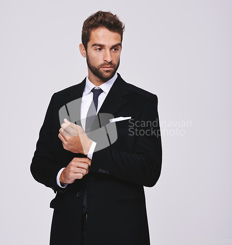Image of Business, thinking and man with ideas, suit and executive agent isolated against a grey studio background. Male person, thoughtful and entrepreneur with formal wear, trendy clothes and stylish outfit