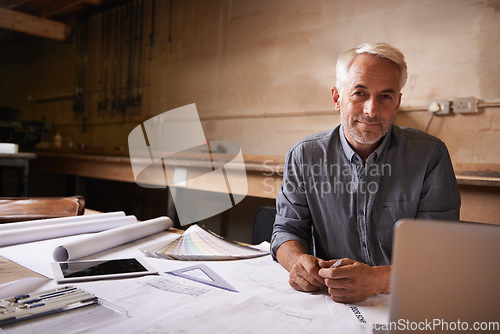 Image of Man, senior architect in portrait with blueprint in workshop, professional designer and engineering. Architecture design, floor plan paperwork and technology with designing and creative male engineer