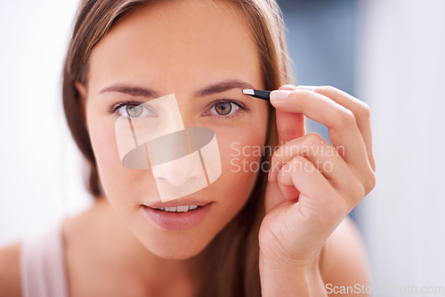 Image of Woman, tweezers and eyebrows in bathroom portrait for skincare, beauty or cosmetics for face in home. Girl, facial hair removal and cosmetic tools for brows, aesthetic or wellness in morning at house