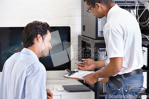 Image of Server room, man or technician with clipboard writing receipt or talking to a client about cyber security glitch. Network, database or contract with a male engineer speaking of information technology