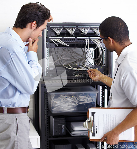 Image of Information technology, men and wire in server room for maintenance, inspection and fixing. Cable, IT technician and fix computer for cybersecurity, networking or database repair in data center.