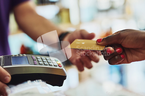 Image of Closeup, hands and payment with machine, credit card and transaction in a store, shopping and buying. Female customer, shopper or buyer with retail, sale and banking with service, profit and discount