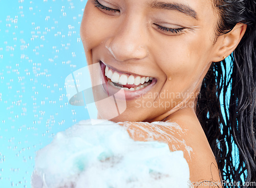 Image of Shower, soap foam and black woman cleaning body with liquid for hydration wash, beauty healthcare or skincare hygiene. Self care studio, spa salon and happy model face isolated on blue background