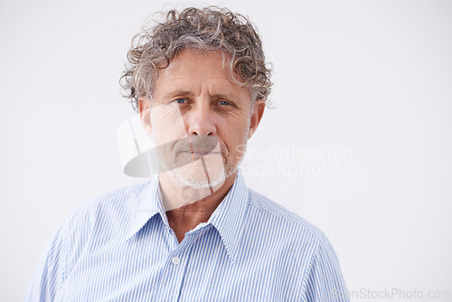 Image of Portrait, business and senior man with confidence, employee and guy against studio background. Face, mature male person and entrepreneur with thoughts, thinking and proud worker with career ambition