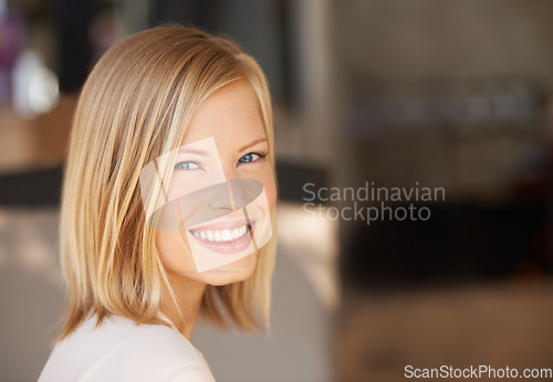 Image of Young woman, smile and portrait with space for mockup, blurred background and happiness at workplace. Girl, mock up and copyspace for promotion, logo and happy with motivation, confidence or pride