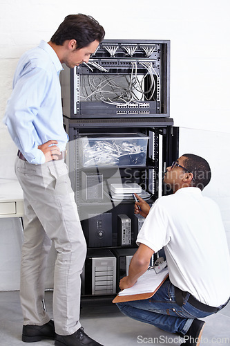 Image of Server room, businessman or electrician with working on hardware maintenance after glitch in office. Network, clipboard or worker with a technician or electrical engineer for information technology