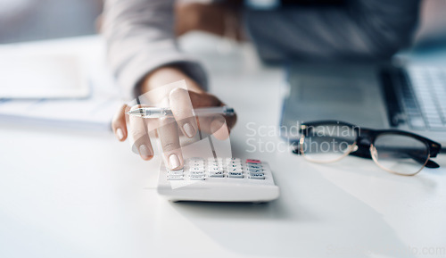 Image of Calculator, accountant and woman working on financial investment report in the office. Accounting, taxes and closeup of female finance advisor doing calculation for asset management in the workplace.