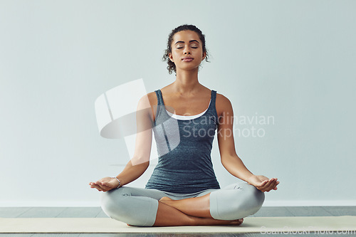 Image of Mindfulness, meditation and woman do yoga for wellness, breathing exercise and healthy body in studio. Mindset, spiritual zen and calm female person meditate for wellbeing, peace and holistic balance