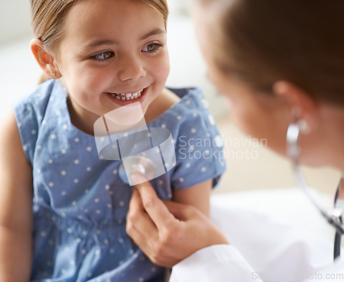 Image of Happy, child and stethoscope of pediatrician for healthcare consulting, check lungs and breathing for heartbeat. Medical doctor, kid and chest assessment in clinic, hospital and helping girl patient