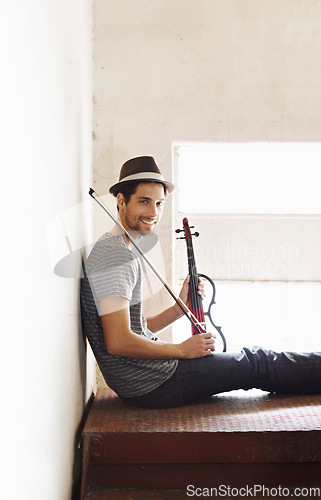 Image of Portrait, musician and man with a violin, smile and training for a performance, sound or happiness at home. Face, male person of happy violinist with joy, creativity and instrument with entertainment