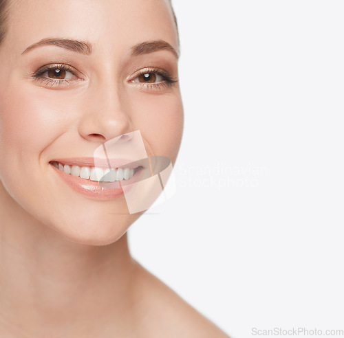Image of Smile, dental care and portrait of a woman with skincare isolated on a white background in studio. Happy, face and a young model showing teeth for oral hygiene with grooming for care of skin