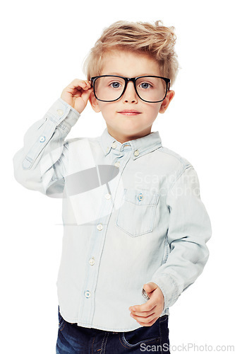 Image of Nerd or geek, portrait of young child with glasses and in white background. Intelligent or smart, serious and isolated child adjusting his spectacles as a confident student in a studio backdrop